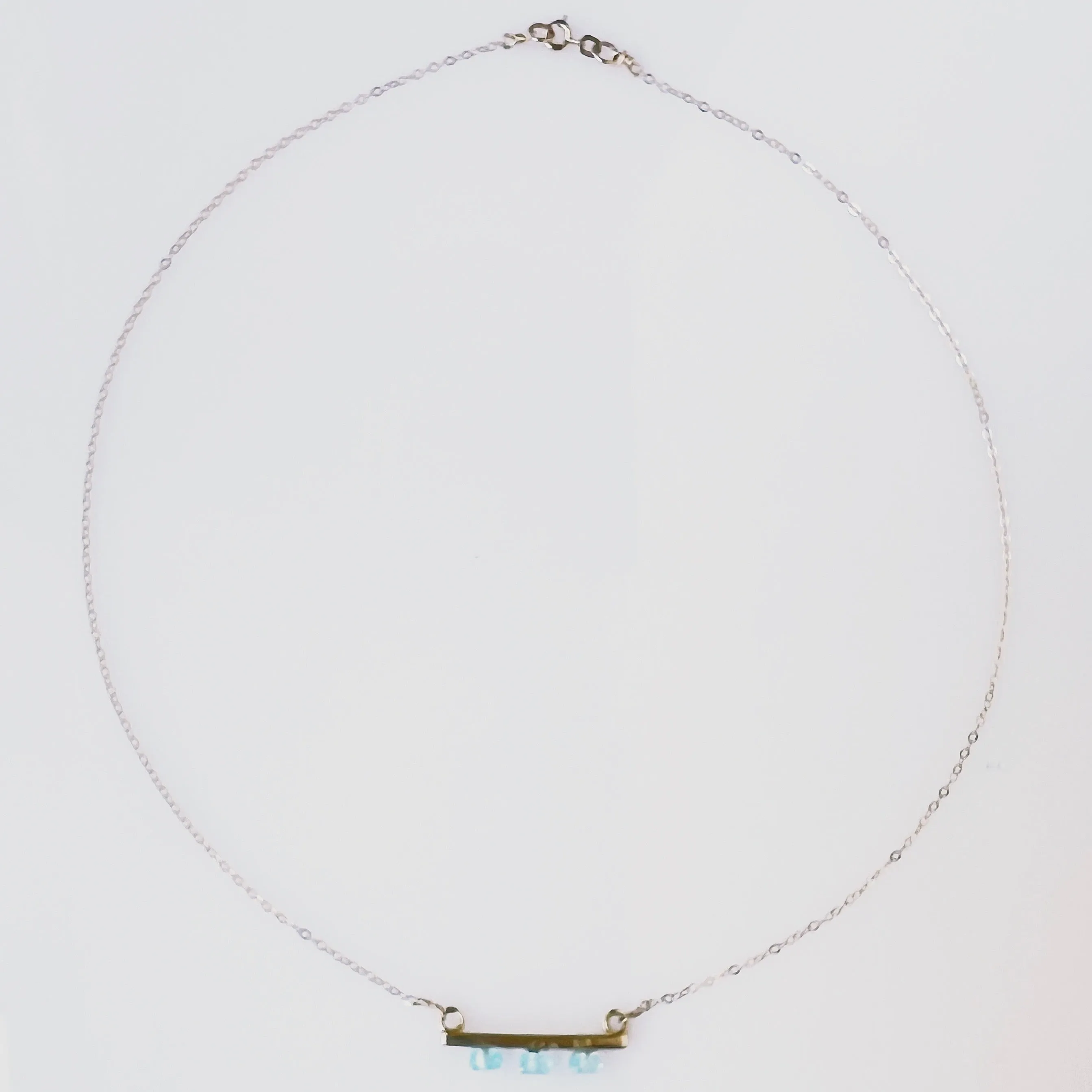 Blue Topaz and Gold Pendant