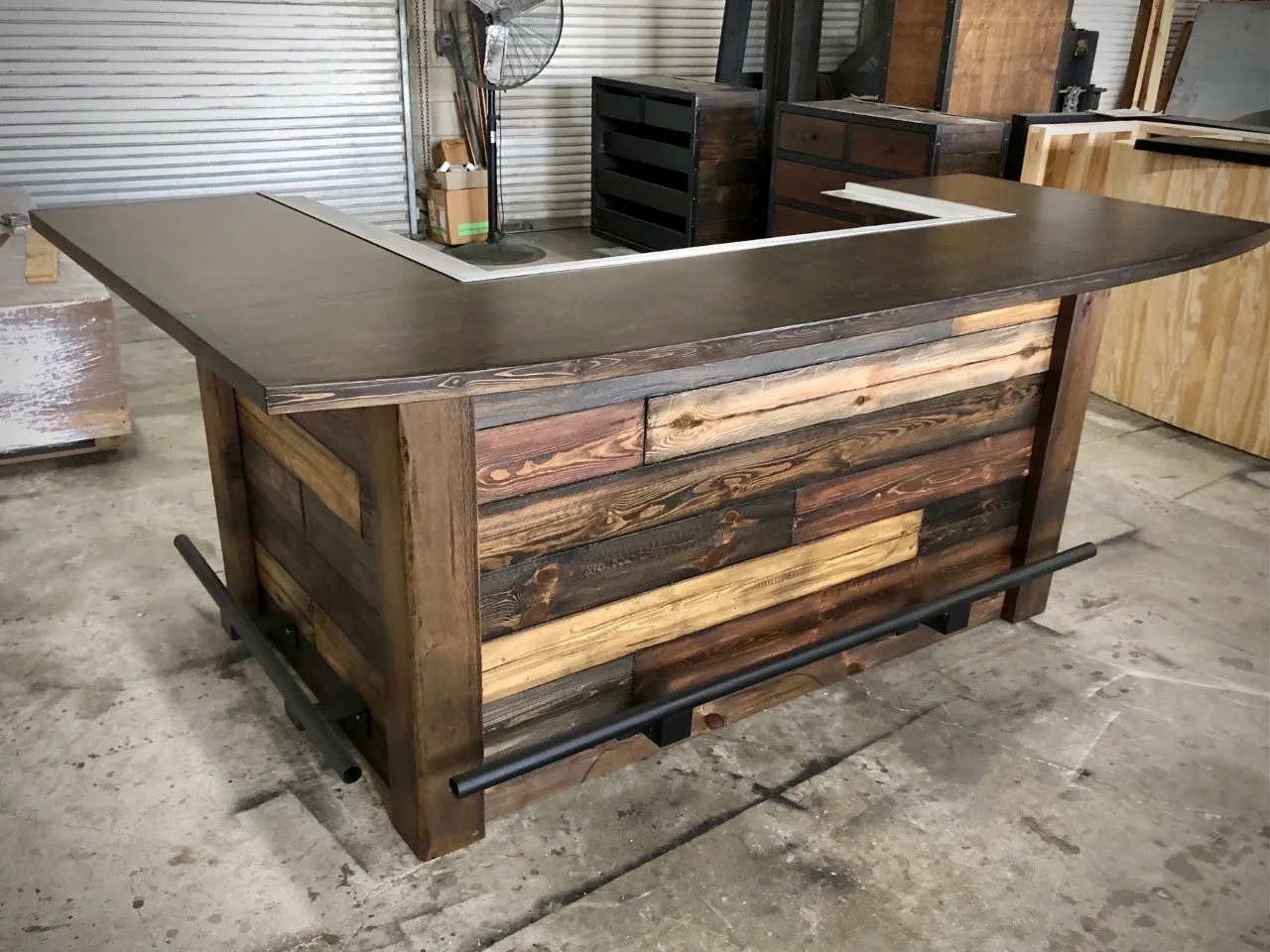 Rustic reclaimed plank goodtimes bar with foot and drink rail
